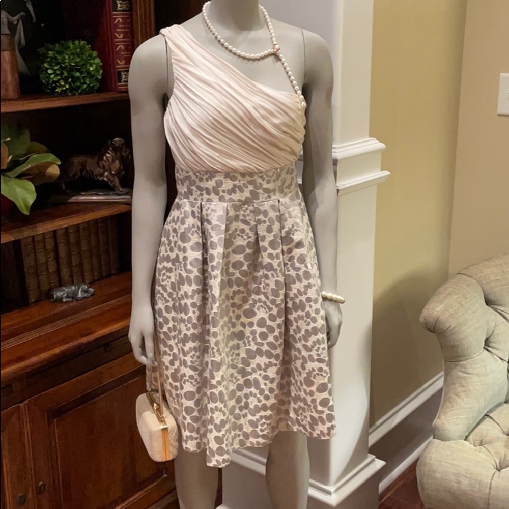 Cocktail length cream and silver dress.